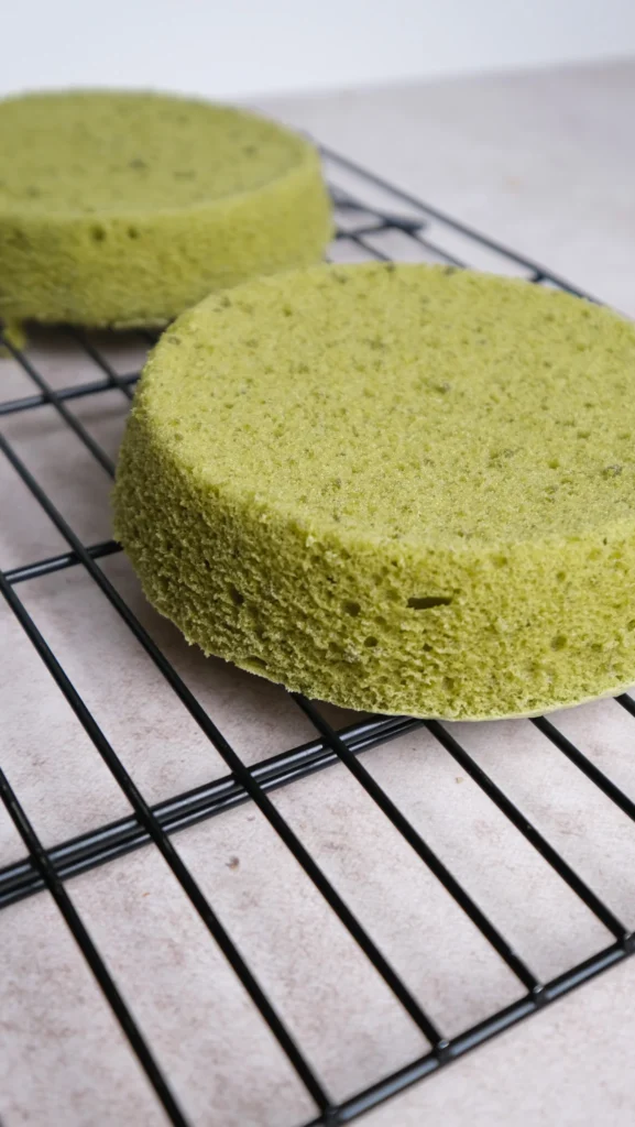 Matcha cake is done and inverted onto a wire rack to cool 