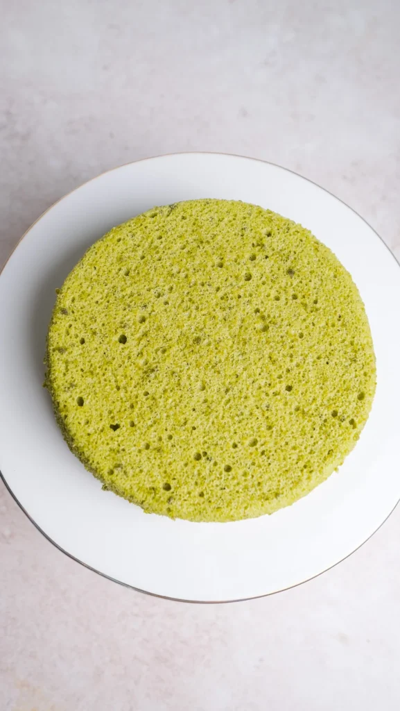 matcha cake on a cake stand 