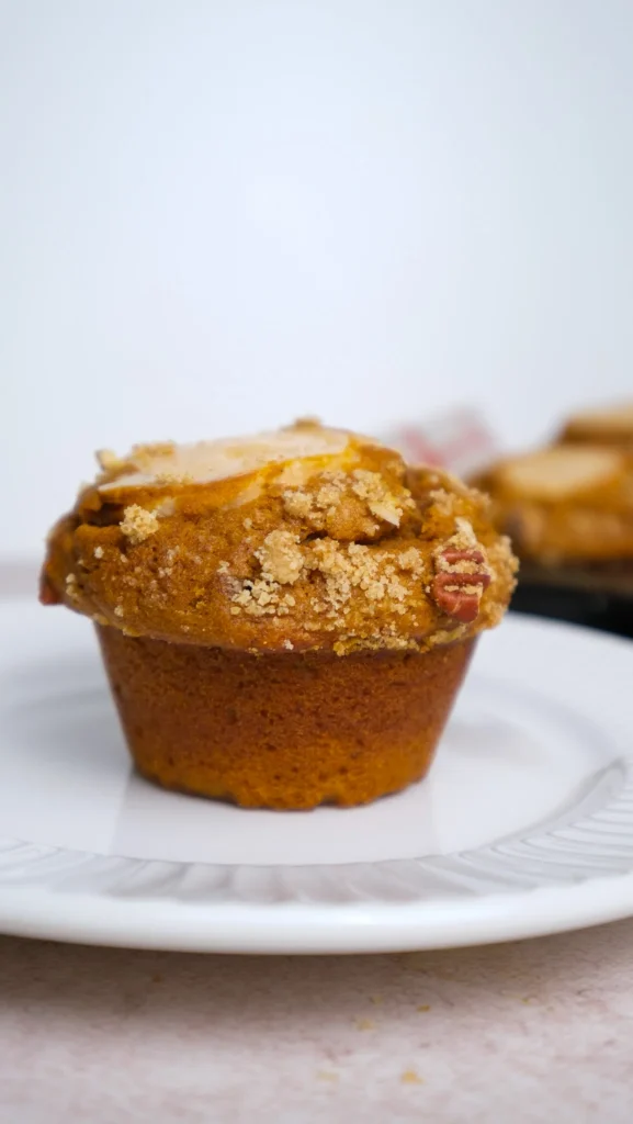 Pumpkin cream cheese muffins on a white plate 