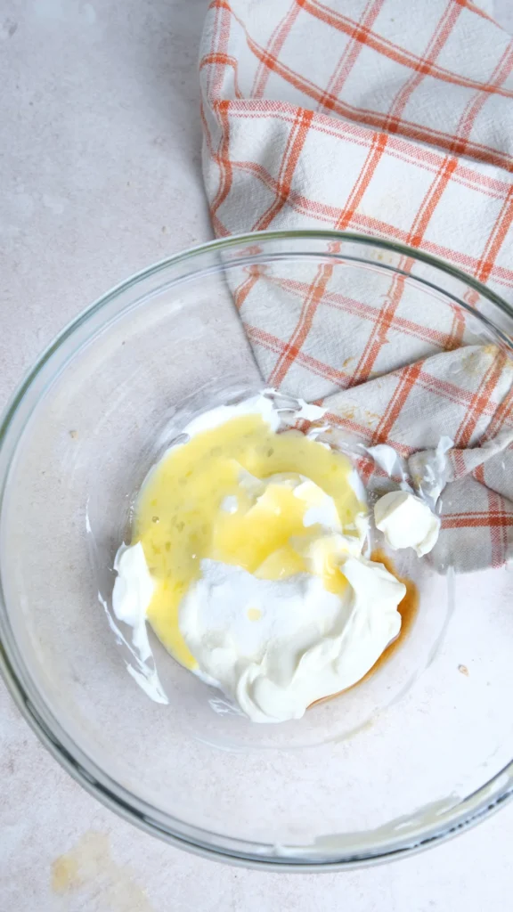 Pumpkin cream cheese muffins cream cheese filling in the bowl unmixed  