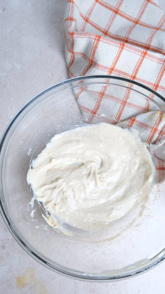 Pumpkin cream cheese muffins cream cheese filling in the bowl mixed 