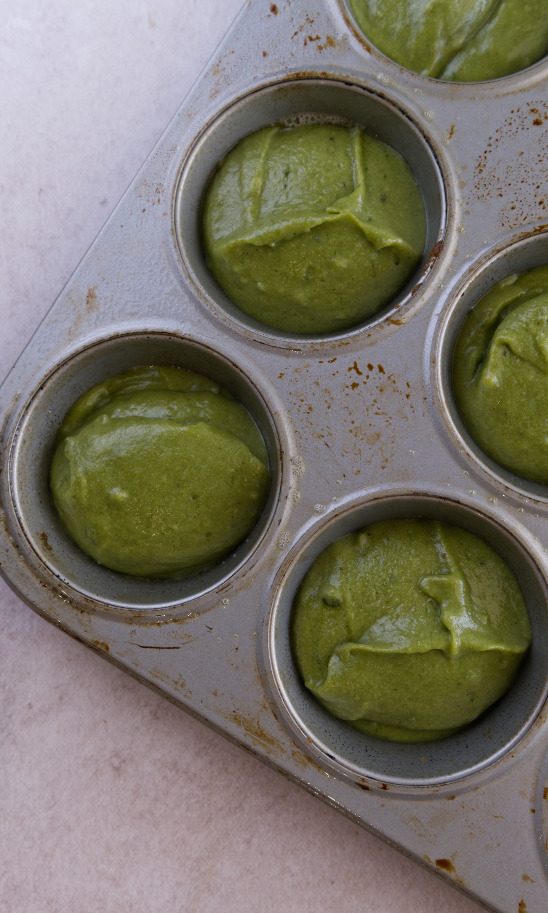 matcha mochi muffins in baking tin