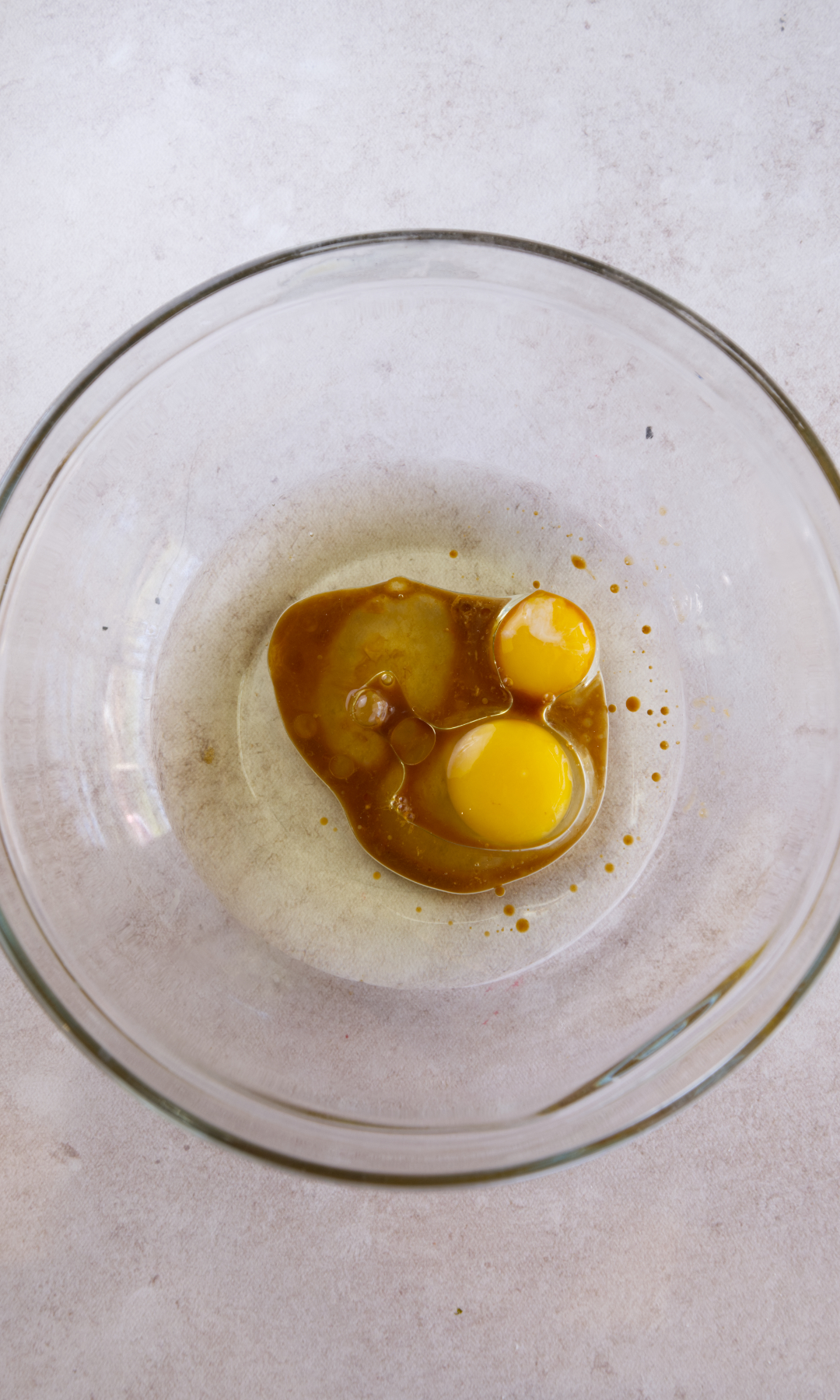 mini carrot cake mixing eggs and oil