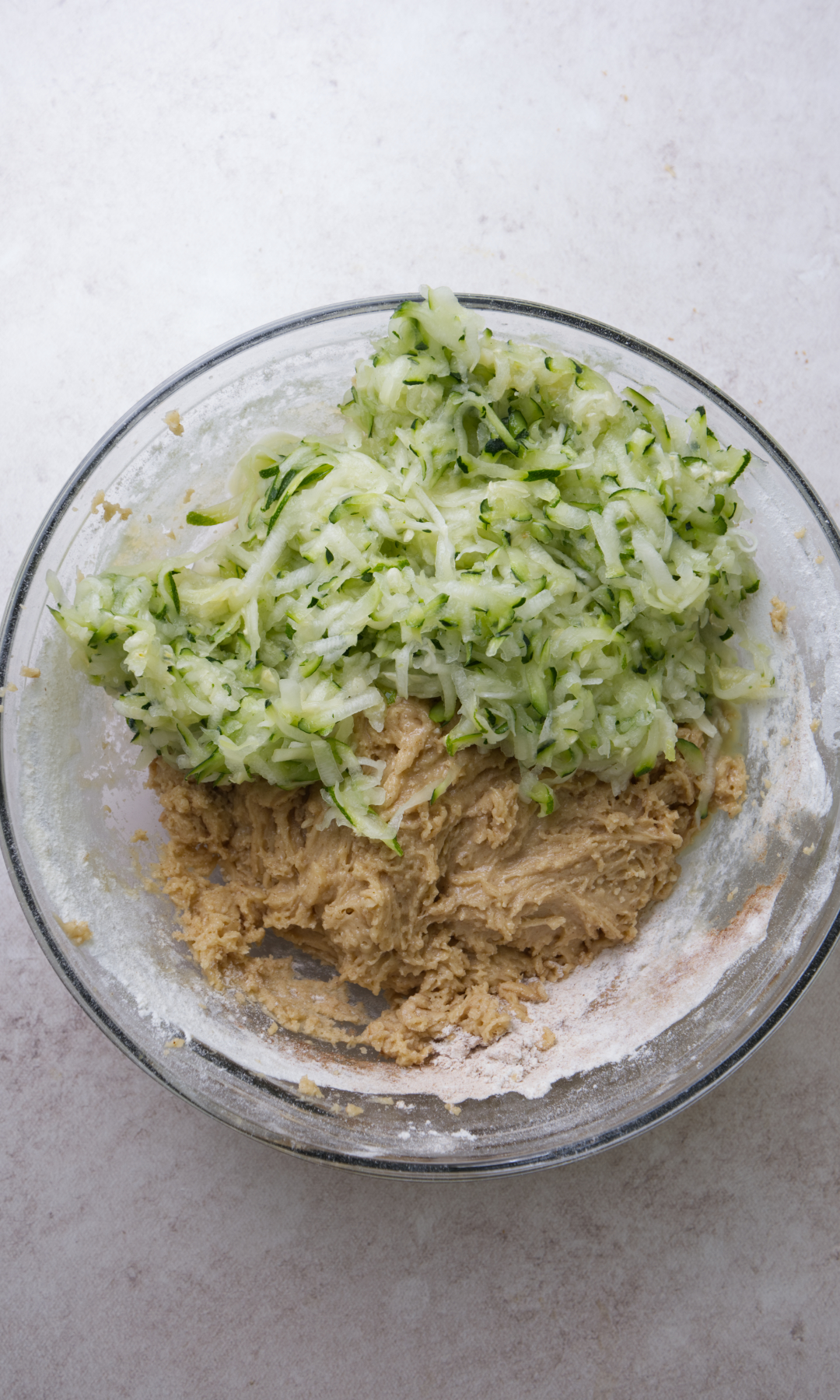 zucchini bread batter with zucchini folded