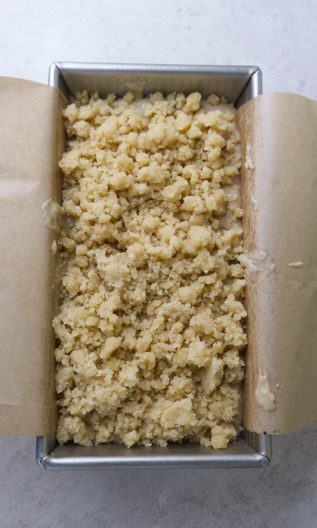 zucchini bread in loaf pan with streusel 