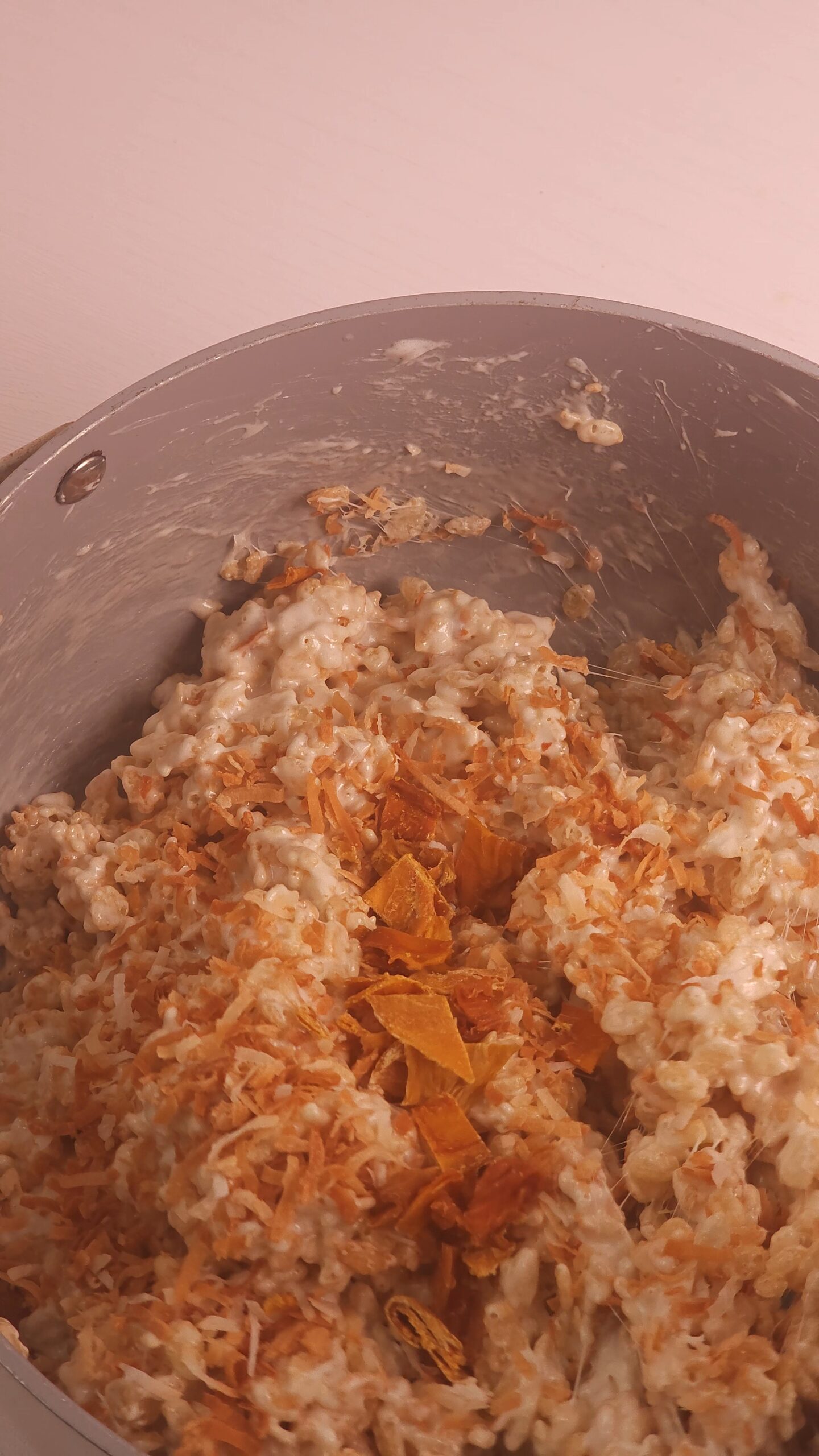 adding more mango and toasted coconut
