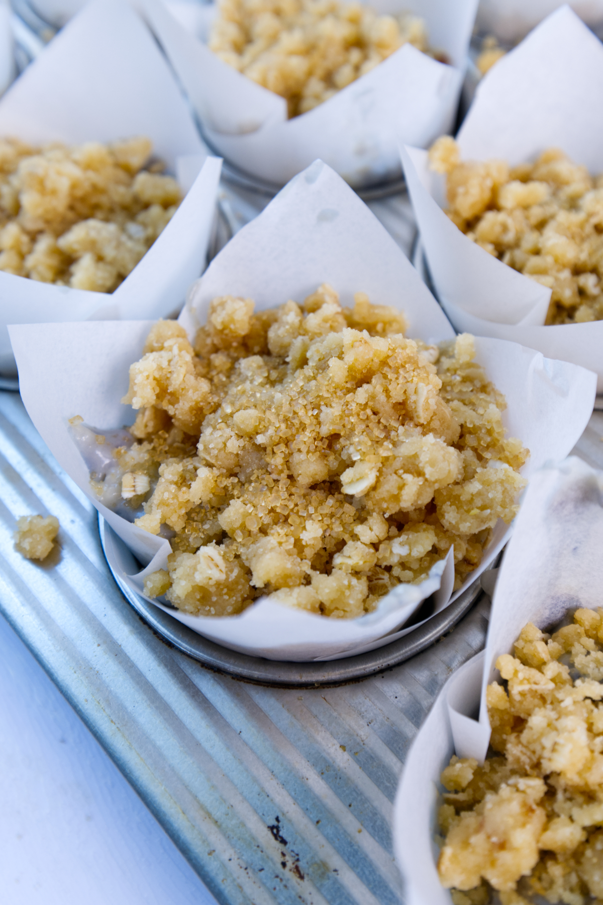crumb topping on top of the muffins 
