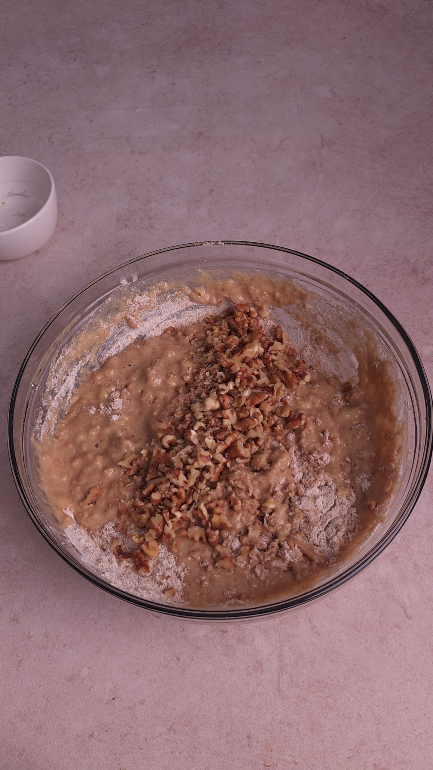 Add toasted nuts to the batter and fold