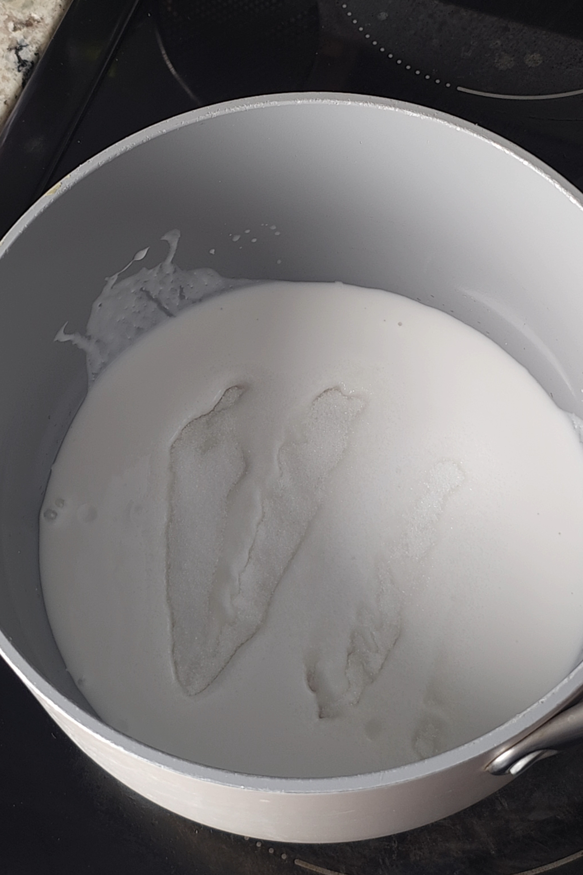 coconut milk and sugar are cooked together