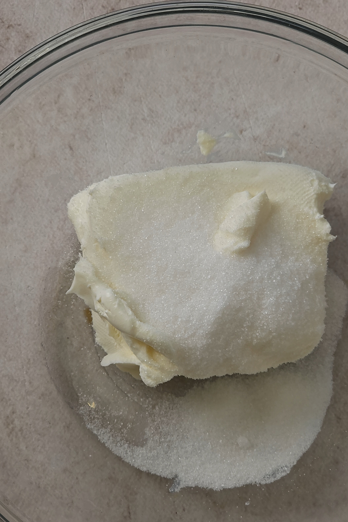 cream cheese and sugar in bowl 