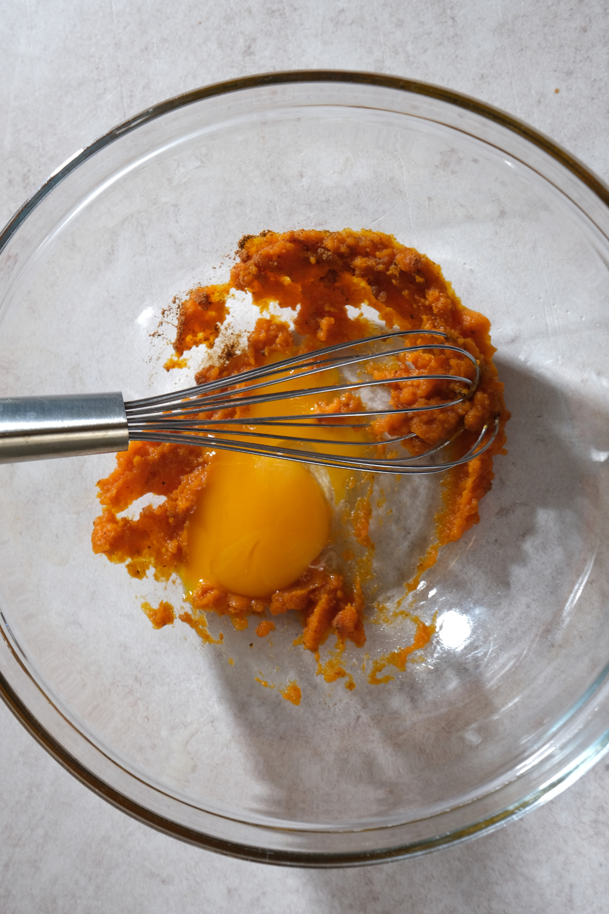 egg yolks and pumpkin puree in bowl