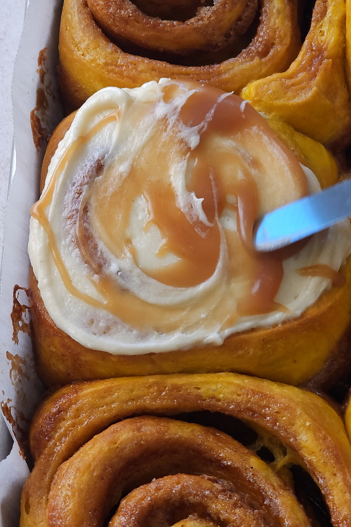 cream cheese and caramel added o pumpkin chai cinnamon rolls