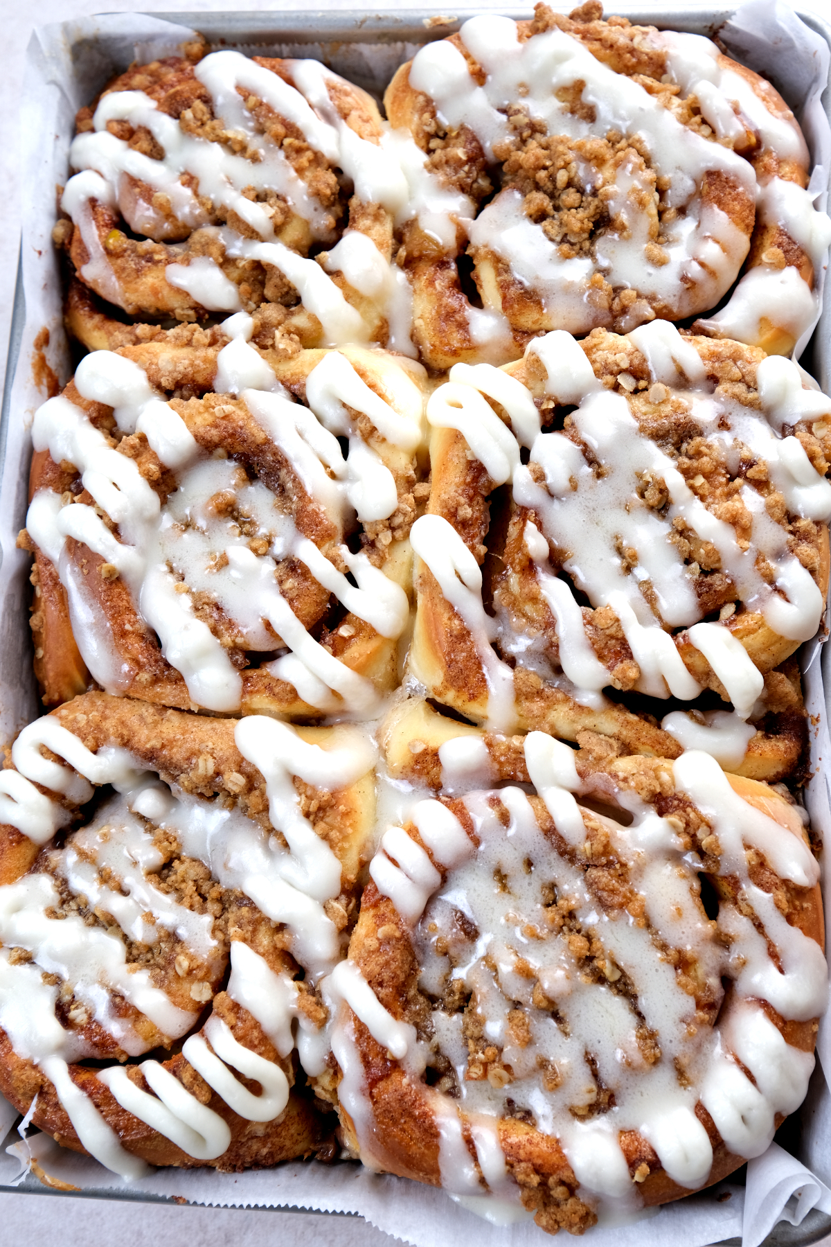 finished glazed and baked apple crumble cinnamon rolls