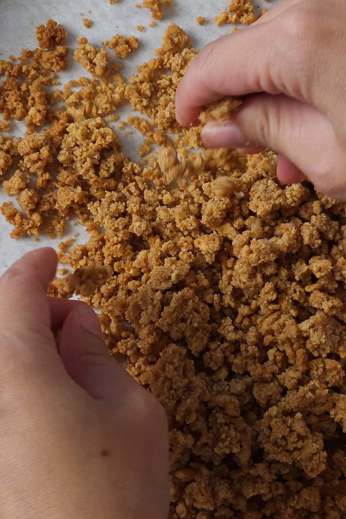 graham cracker crumbles breaking smaller with hands 