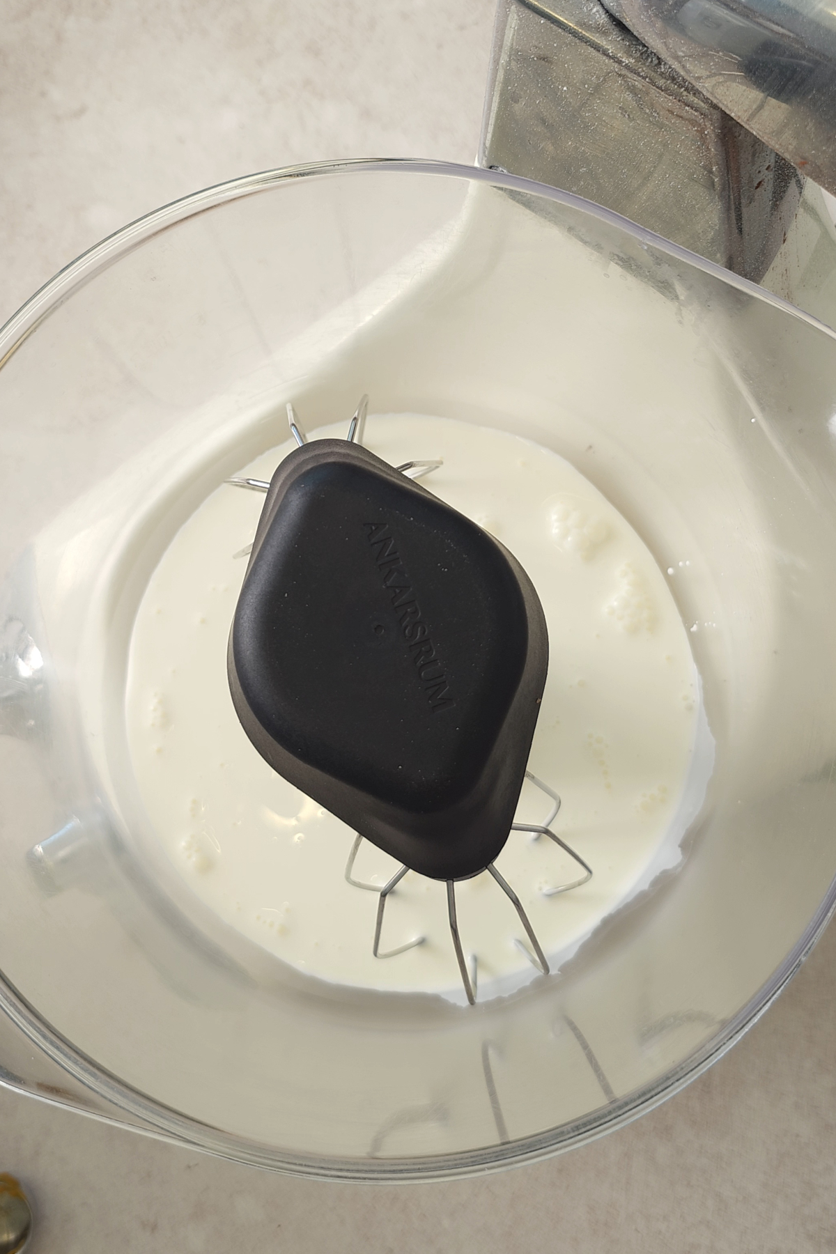 heavy cream in mixing bowl 