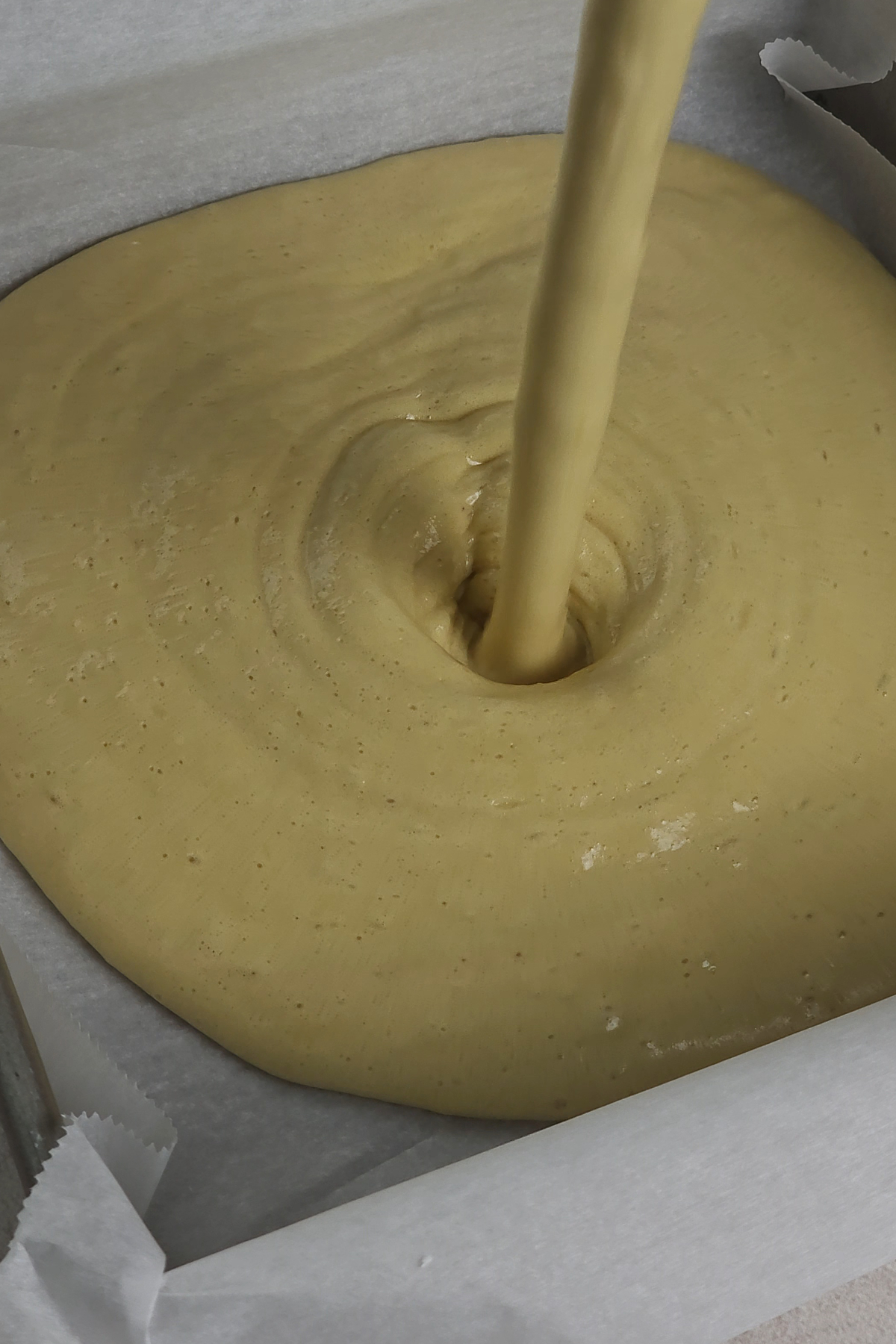 cake batter poured into cake pan