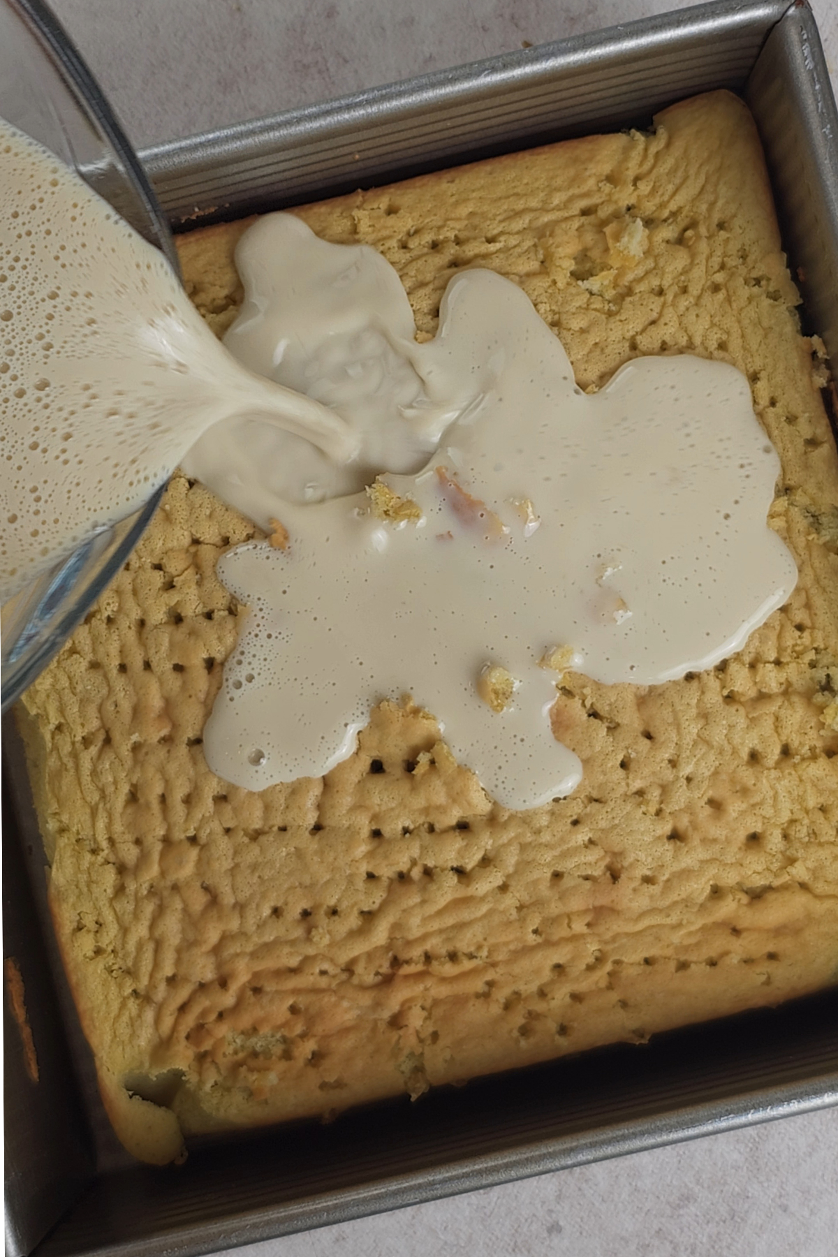 milk poured into cake holes