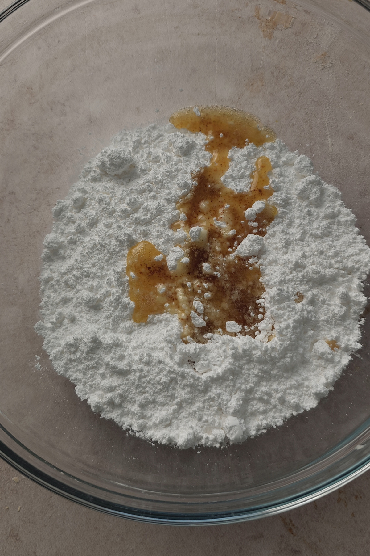 Brown butter and powdered suagr in clear bowl