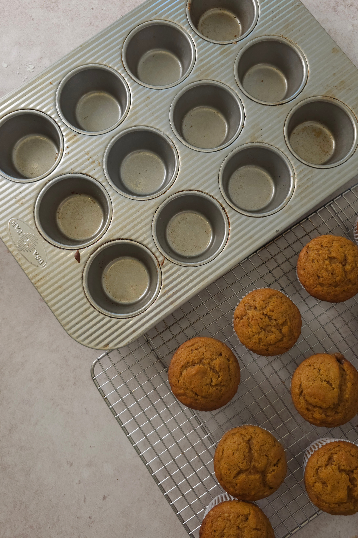 pumpkin cupcakes cooling on wire rack 