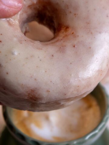 pumpkin donut with mug in back