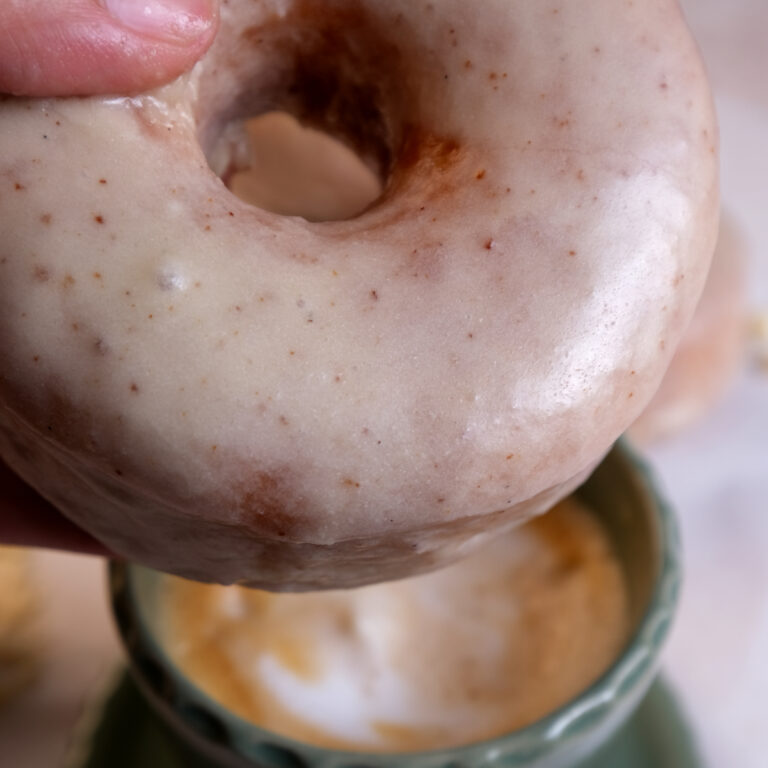 pumpkin donut with mug in back