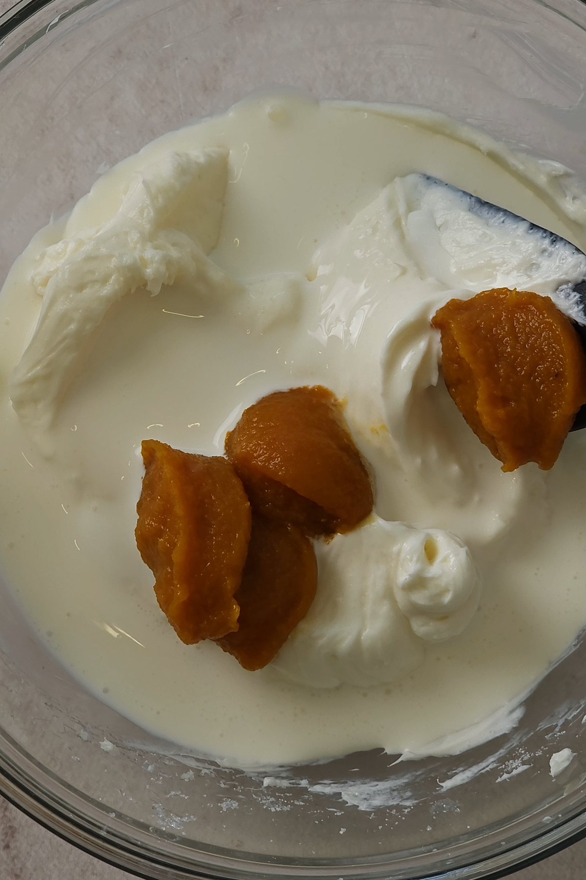 cream cheese, pumpkin and heavy cream in bowl 
