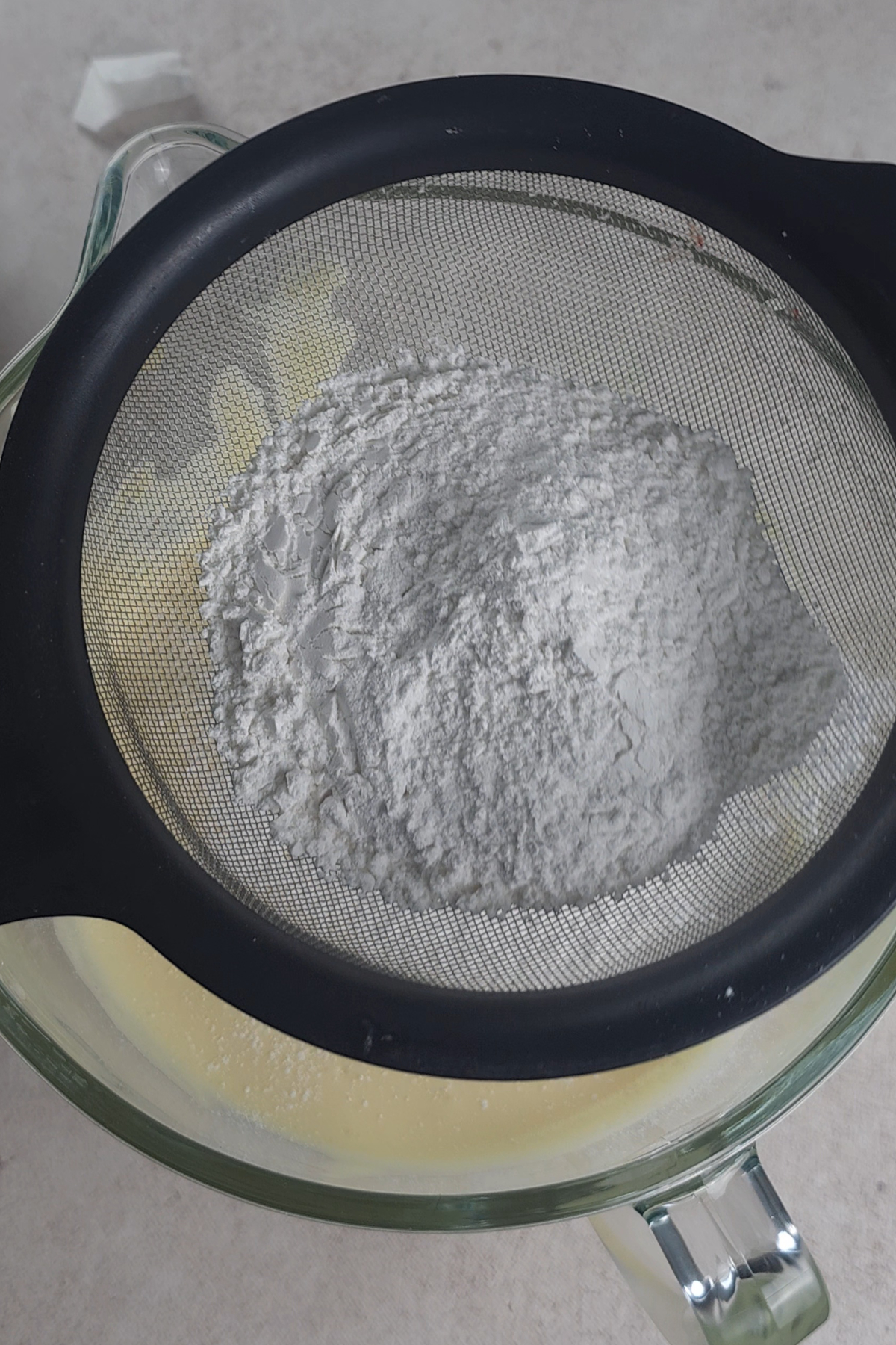 sifted flour over the whipped eggs and sugar