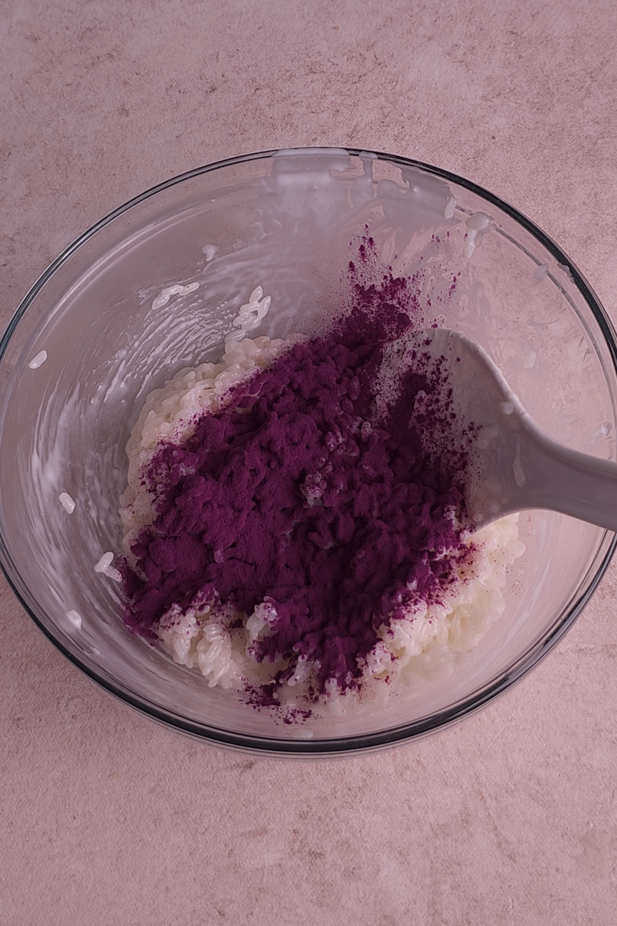 ube powder is added to the coconut milk rice