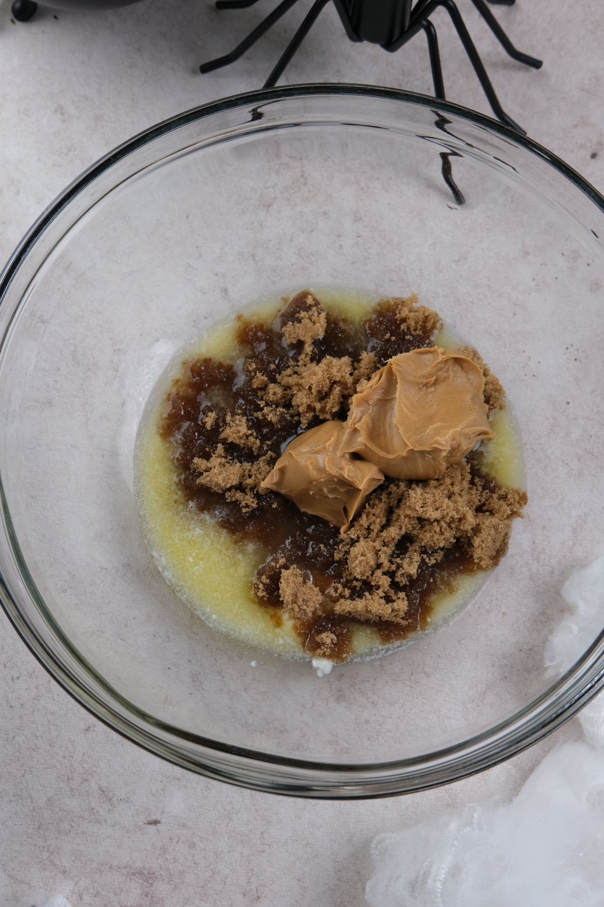 butter and sugar in glass mixing bowl